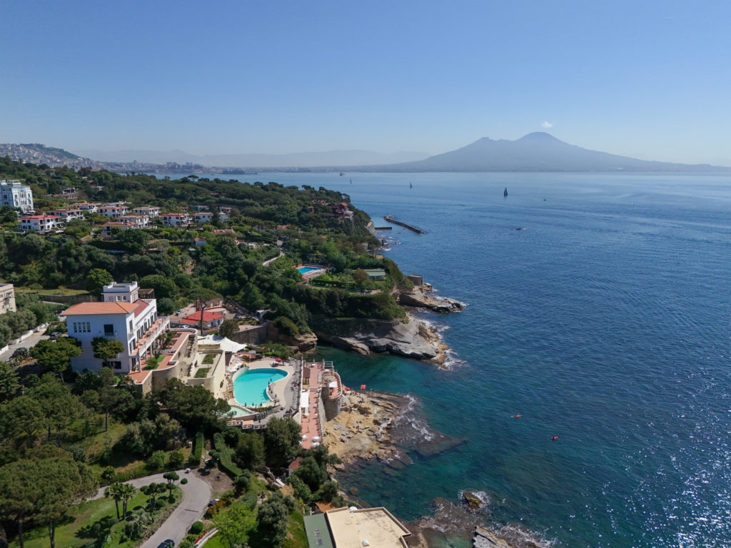 Stone interior of a holiday home by the sea in Naples with Vesuvio view.